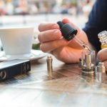 WASPE 12000 PUFFS The outstanding choice in the field of e-cigarettes_Man filling an electronic cigarette or vaporizer with e liquid